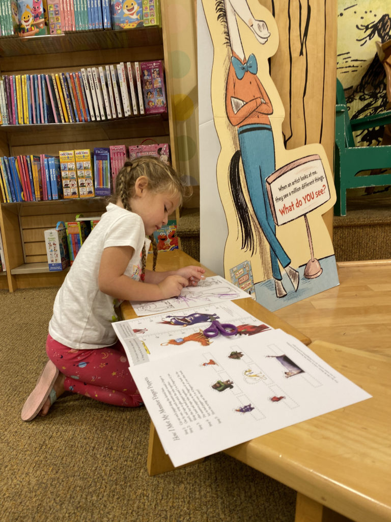 Little girl at Barnes & Noble in Mishawaka coloring during story time activities. 