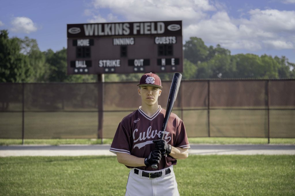 Culver Military Academy Baseball Player holding bat on Wilkins Field.