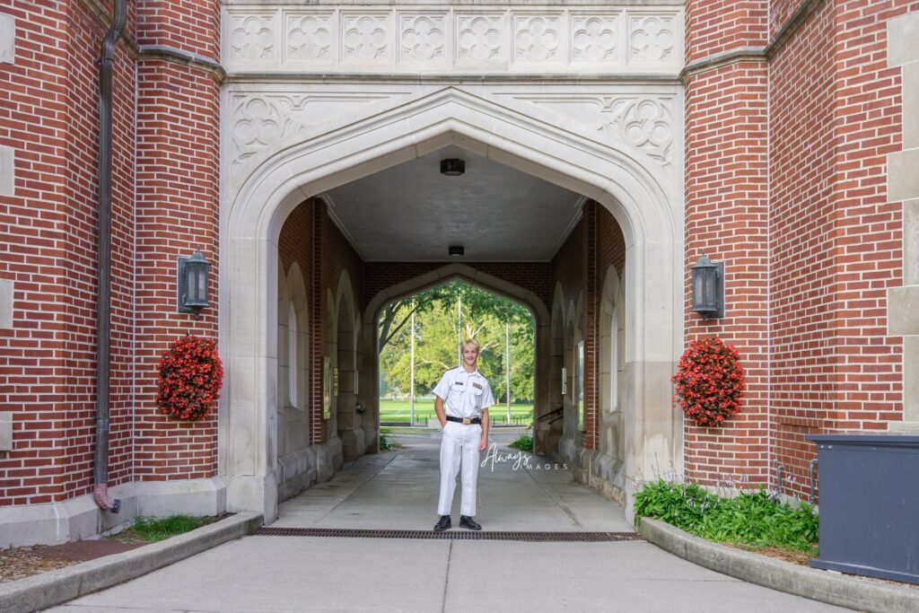 Culver Upper Camp student in Dress A white uniform for formal portrait in Sallyport. 